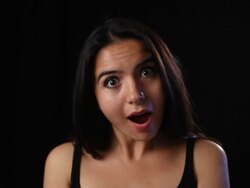 Eyes wide open young woman surprised Stock Footage