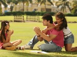 Man telling stories to his daughters in a park Stock Footage