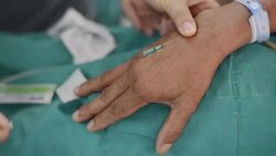 open intravenous fluid for patient Stock Footage