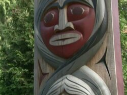 CU TU TD Totem pole with three Faces in stanley park / Vancouver, British Columbia, Canada Stock Footage