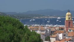 St Tropez with Church Bell tower and yachts in the distance.4K Stock Footage