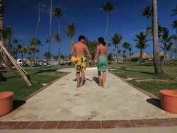 Good Looking young couple walk holding hands on holiday Stock Footage
