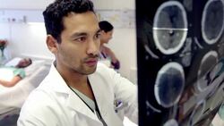 Doctor examining MRI scans in hospital room Stock Footage