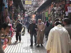 People shopping in a Souk in Marrakech, Morocco, Africa Stock Footage