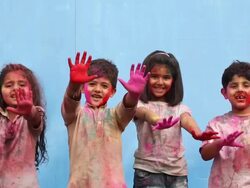 Portrait of four kids celebrating holi festival Stock Footage