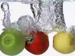 MS SLO MO Apples entering into water against white background / Vieux Pont, Normandy, France  Stock Footage