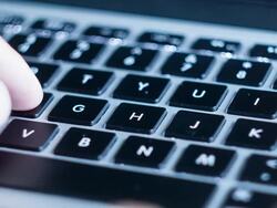 Hand typing a laptop Stock Footage