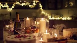 Champagne and Christmas desserts on candlelight table Stock Footage