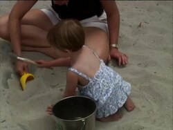 Mother and Child Play in Sand Stock Footage