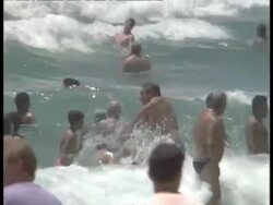 MCU Many people playing in surf at beach Stock Footage
