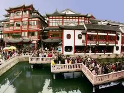 Time lapse high angle wide shot crowds on nine-turn zig-zag bridge at Yuyuan Bazaar / Shanghai Stock Footage