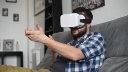 Young adult man and a virtual reality headset.Guy using vr glasses Stock Footage