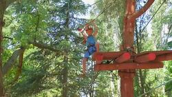 boy in the municipal rope park Stock Footage