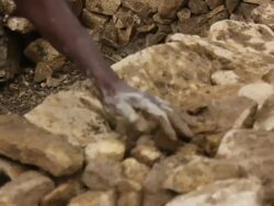 Afar men build stone enclosure Stock Footage