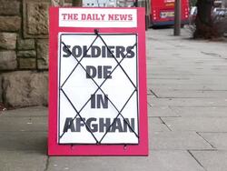 Newspaper headline board - Soldiers die in Afghanistan Stock Footage