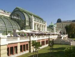 Vienna Hofburg Palace and Palmenhaus (Palm House) in the Burggarten  Stock Footage