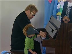 Elton John recovering in hospital from flu and e coli News Clip