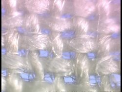 ECU track right, White Cotton fibres, chequered effect of weave Stock Footage