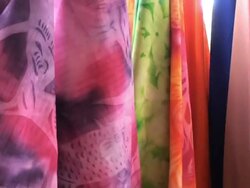 Swirling colored pareos as background at the street market Stock Footage