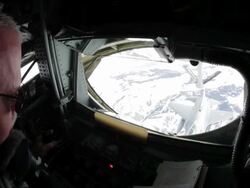 CU Refueling crewman during F-16 mid-air refueling, Colorado Rockies, Colorado, USA Stock Footage