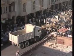 WRAP Hospital scenes, outside shrine, protest, coffins News Clip