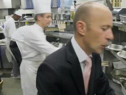 POV food being prepared at the hot plating area in a restaurant kitchen; chef looking at incoming orders Stock Footage