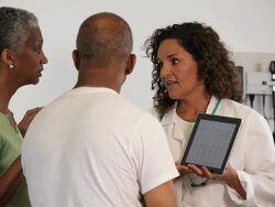 "doctor discussing medical records with patient and his wife/Richmond,Virginia, USA" Stock Footage