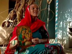 Ethiopian woman holding image of Jesus and Virgin Mary Stock Footage