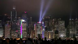 Bright lights beam from the Bank of China building in Hong Kong. Stock Footage