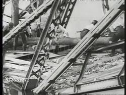 1939: NAZI WWII PROPAGANDA: XHA WS Panzer tanks moving out of field in line. VS Destroyed bridges, sabotaged. Nazis 'work crews' (forced labor) to repair, crew carries giant log, railroad tie. Calvary crossing repaired bridge w/ artillery cart. Instructional Video