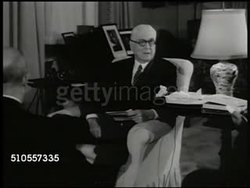 1950: U.S. STATESMAN BARUCH:  LS New York street, Manhattan apartment building. INT VS Statesman Bernard Baruch (1870-1965) sitting in chair talking to reporters '...greatest threat... military defeat abroad.... must fully organize now...' Korean War Instructional Video