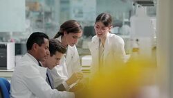 Scientists and businessman talking in laboratory Stock Footage