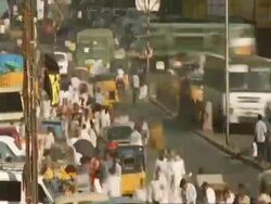 T/L - MCU High angle view of traffic and people moving through Indian city street, Madras Stock Footage