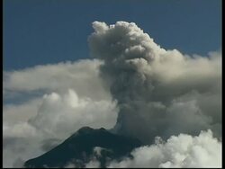 MS grey smoke and ash cloud billow from crater into sky, Mount Tunguragua, Ecuador Stock Footage
