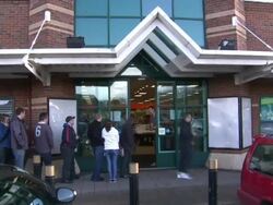 People Queueing Outside Comet Store News Clip