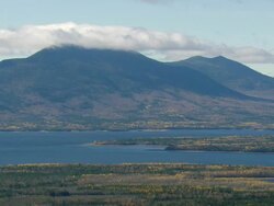 WS ARIEAL View of clouds flowing over peaks and river /Maine, United States Stock Footage