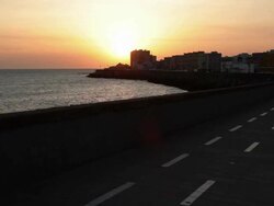 "Sunset at Harbor with runner in Cadiz, Spain." Stock Footage