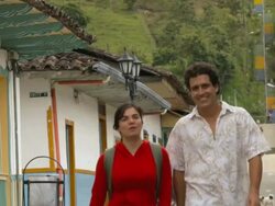 MS Couple walking on colorful street in town / Salento, Quindio, Colombia Stock Footage