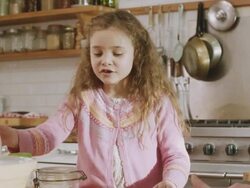 CU Shot of daughter face as she gets ingredients that are reading of recipe by daddy / London, United Kingdom  Stock Footage