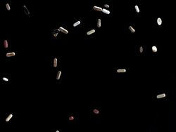 HD Super Slow-Mo: Pills Falling Over Black Background Stock Footage