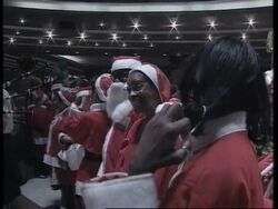 SOUTH AFRICA: JOHANNESBURG: DELEGATION OF US FEMALE SANTAS ARRIVE News Clip