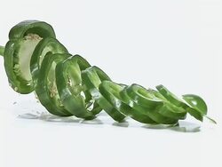 MS SLO MO Green capsicum falling on floor against white background / Vieux Pont, Normandy, France  Stock Footage