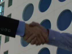 Cu of male and female greeting with handshake Stock Footage