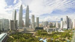KLCC Park provides green space close to the Petronas Twin Towers in the Kuala Lumpur City Centre. Stock Footage