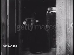 1940: VATICAN CITY: Master of the Chamber Monsignor Arborio Mella di Sant'Elia walking into building, into elevator, walking past Swiss Guards. Instructional Video