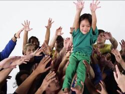 Young Boy is Lifted into the Air in Celebration Stock Footage