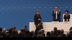 CLEAN : Merkel vows to reduce refugee influx but rejects cap News Clip