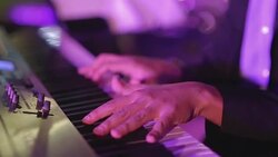 Close up human hand playing piano at concert party Stock Footage