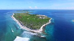 Moving forward over Kanton Island and WWII remains Stock Footage