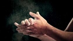 SLO MO Gymnast clapping excess chalk off his hands Stock Footage